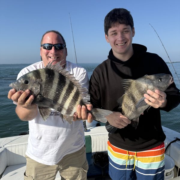 excited fishing crew with an amazing catch off shore in Charleston, SC with Short Skirts Sportfishing